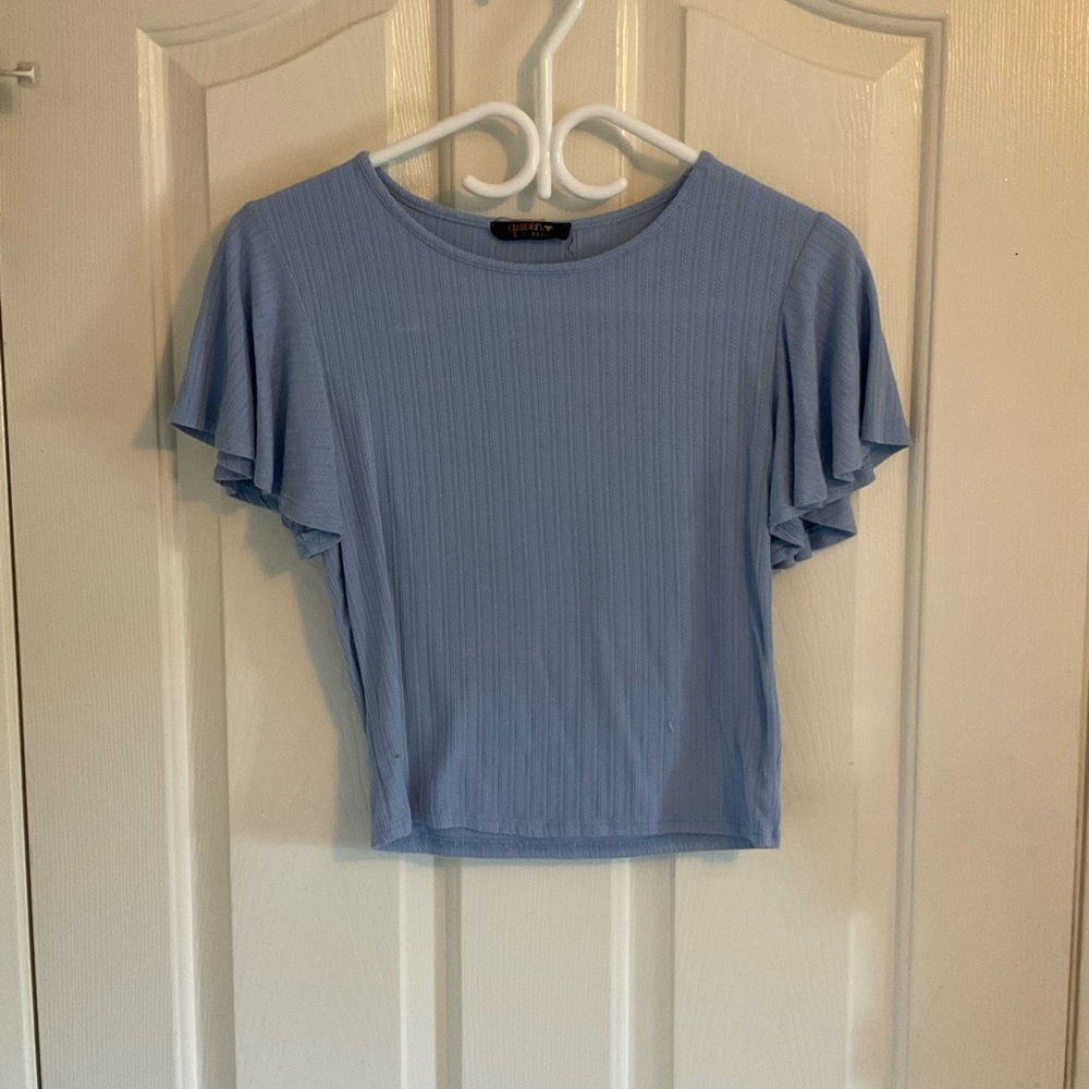 Queen Bees small light blue patterned top.